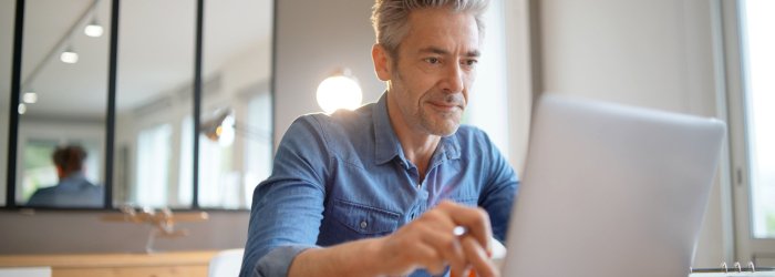 Mature man working from contemporary home