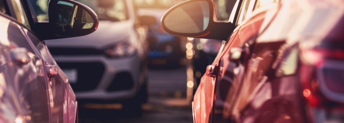 Close Up Of Fleet Of Variety Of Passenger Vehicles At Dealership Outdoor Parking Lot.